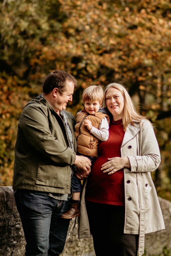 family poses for an autumn family photoshoot