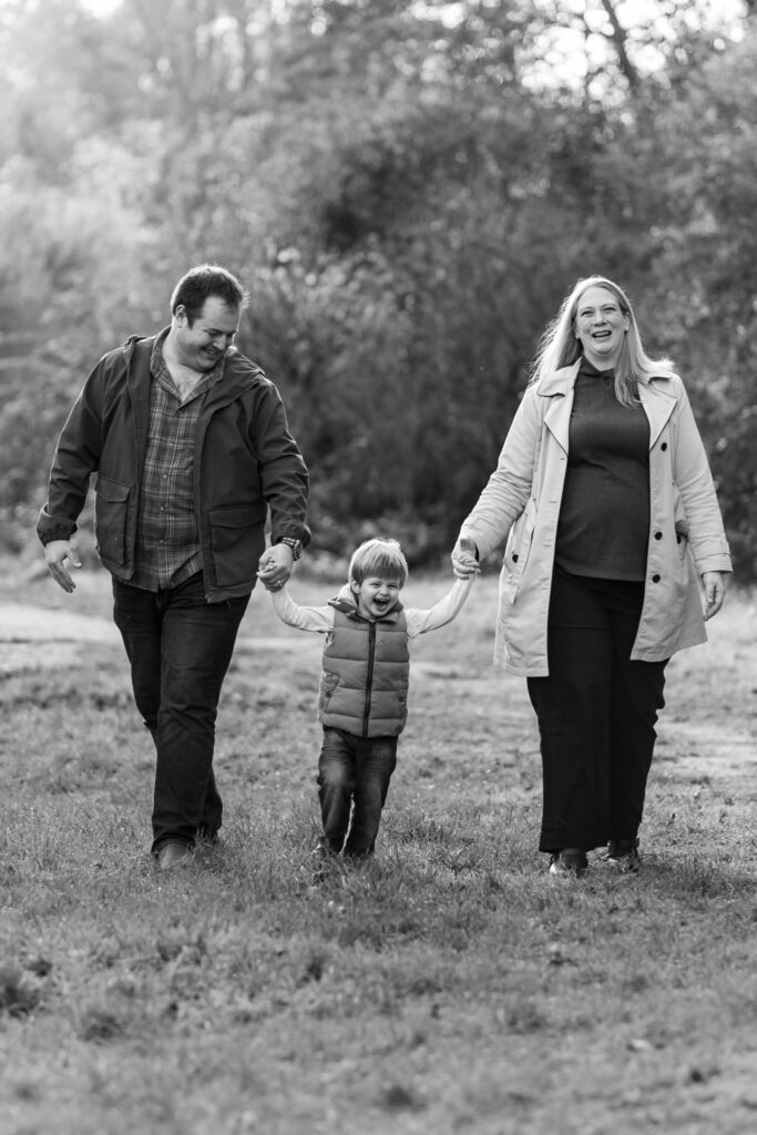 family smiling together during autumn family photoshoot