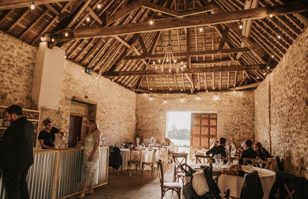 Inside a rustic cider barn converted to a wedding venue