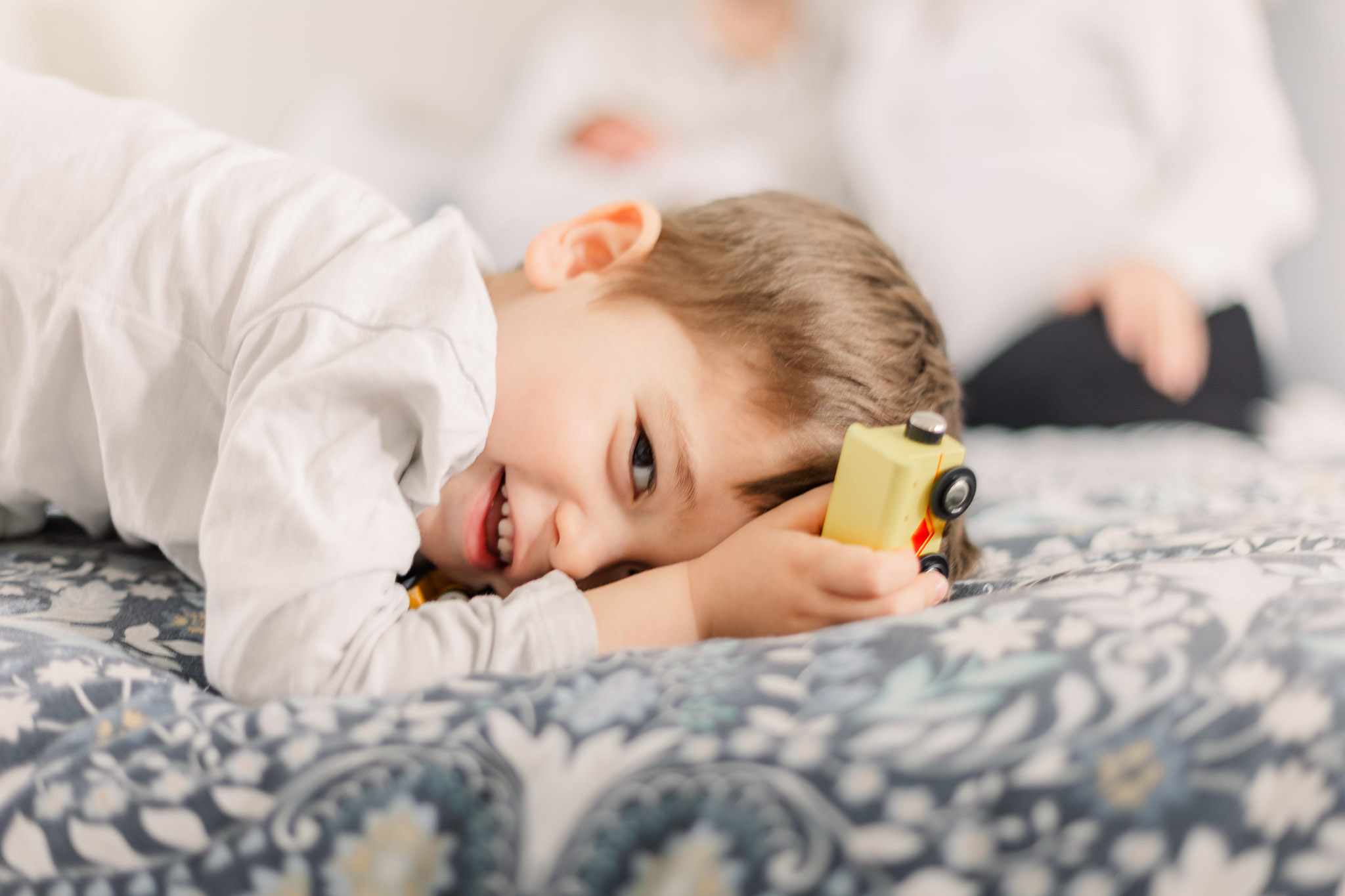 Cheeky Toddler at Newborn Photoshoot