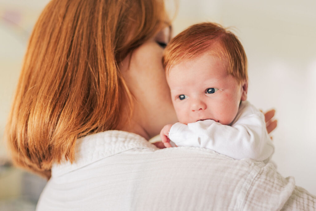 Newborn looks over mothers should 