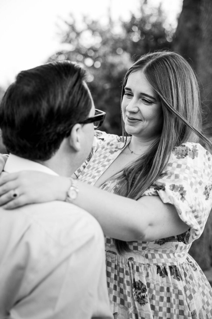 Bride to be smiles at her fiance during pre wedding photoshoot