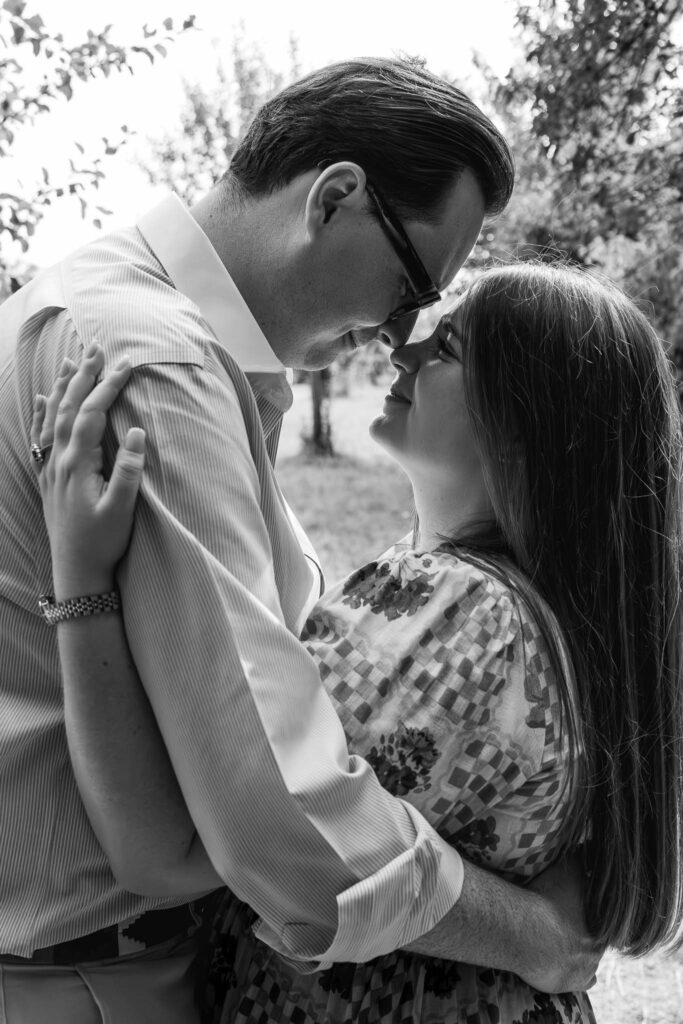 Engaged couple touch noses