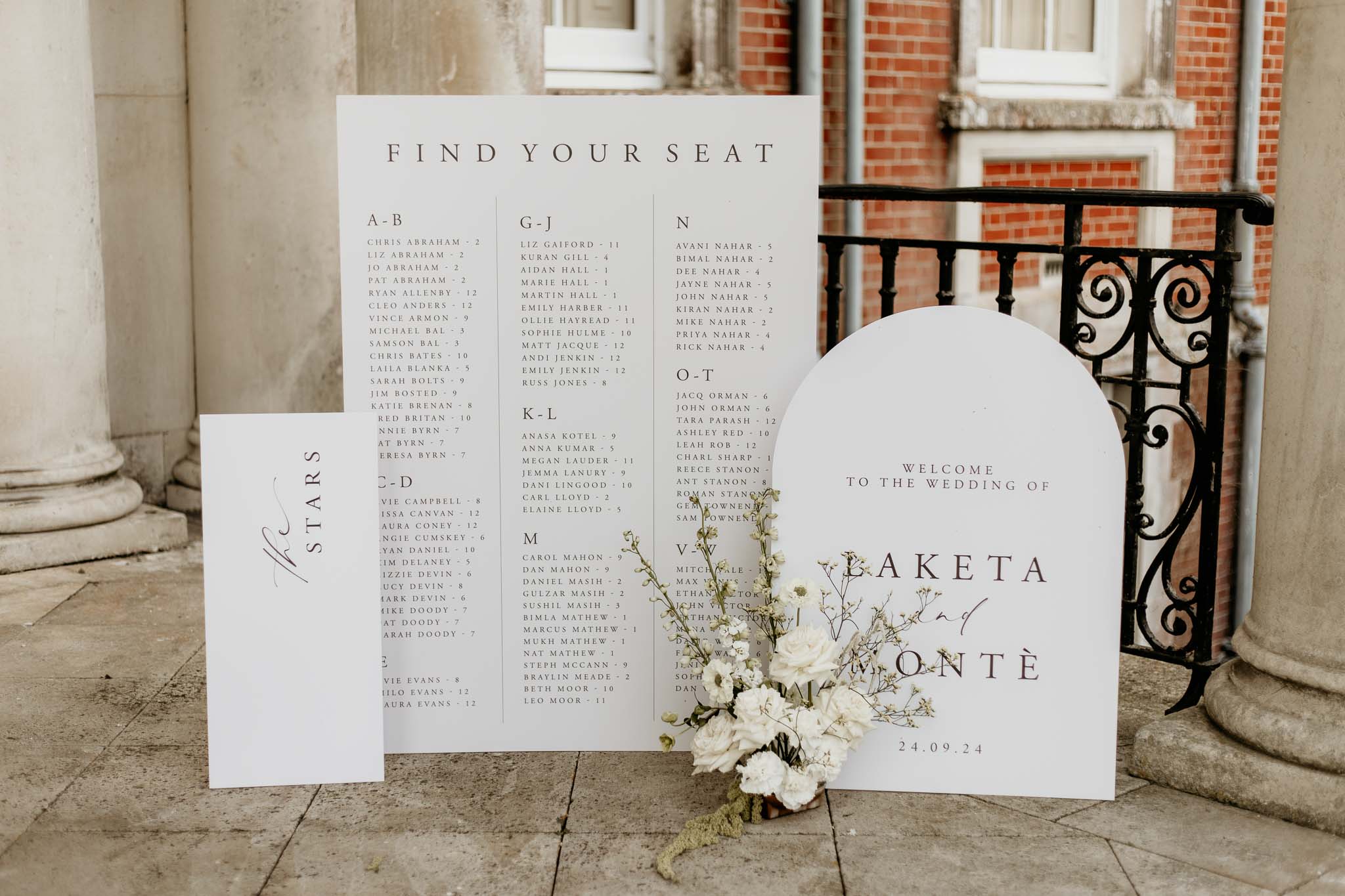 Wedding day seating plan in elegant white and gold