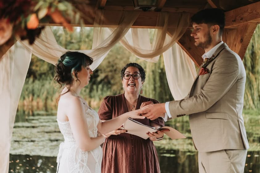 Wedding Celebrant Julia Anne performs ceremony by beautiful lake